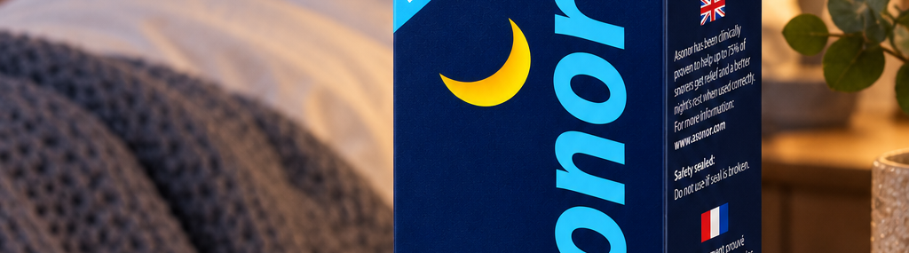Asonor package on a bedside table with a couple resting in the background.