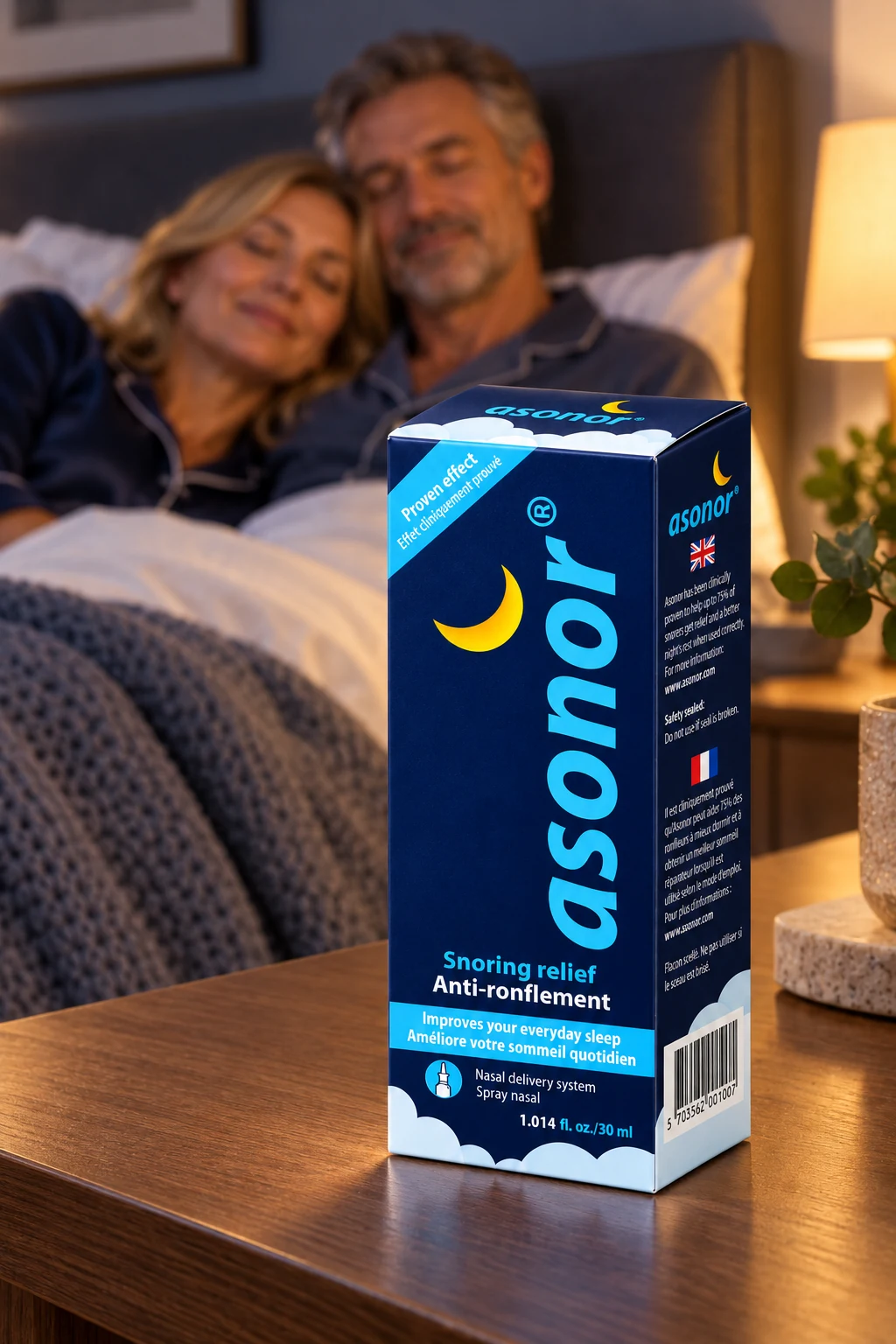 Asonor carton on a bedside table with a couple resting in the background